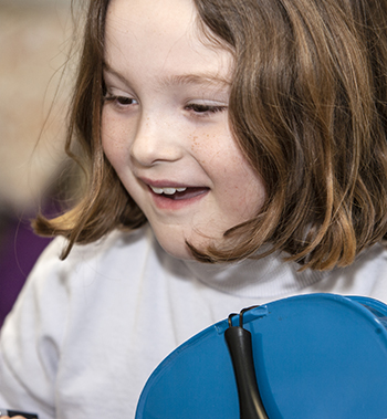 child happy with her fiddle progress  