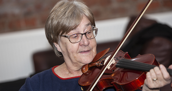 Adult playing violin